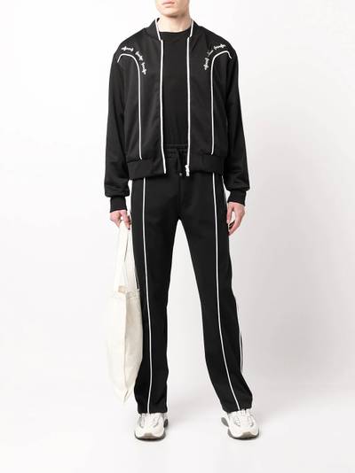 AMIRI piped-trim cotton track trousers outlook