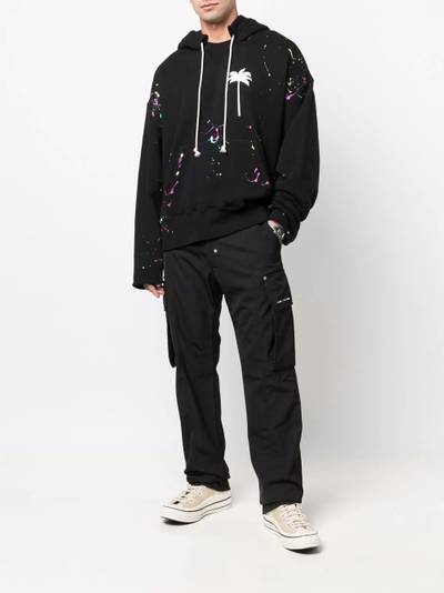 Palm Angels palm-print paint-splatter effect hoodie outlook