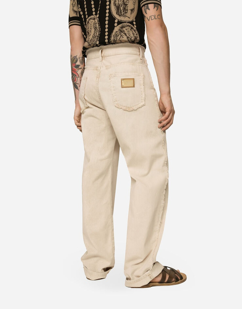 Overdyed jeans with raw hem details 4