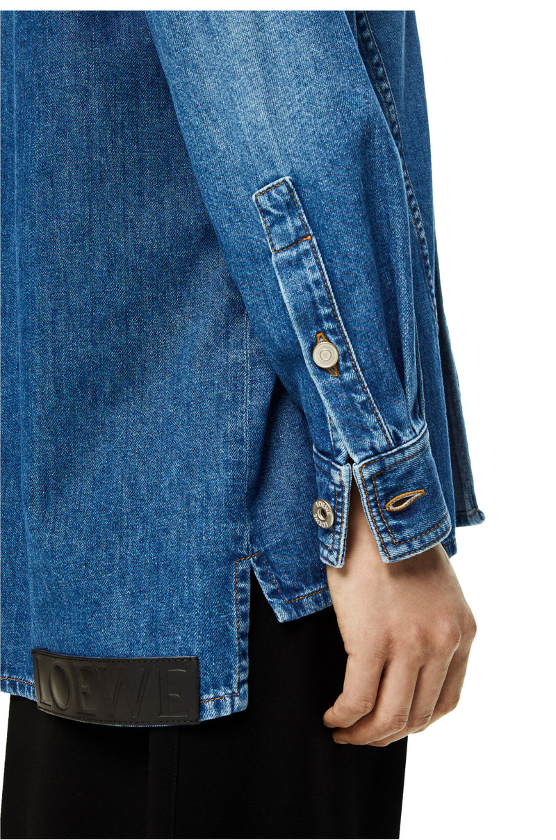 Slanted overshirt in washed denim 5