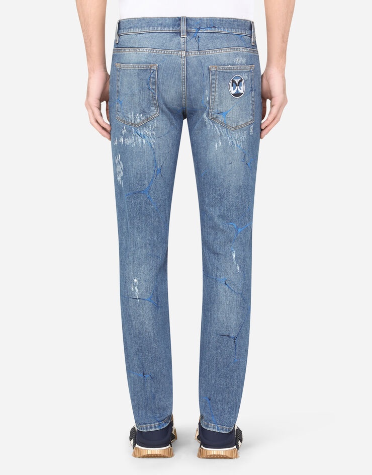 Washed blue skinny stretch jeans with rips and brushstrokes - 2