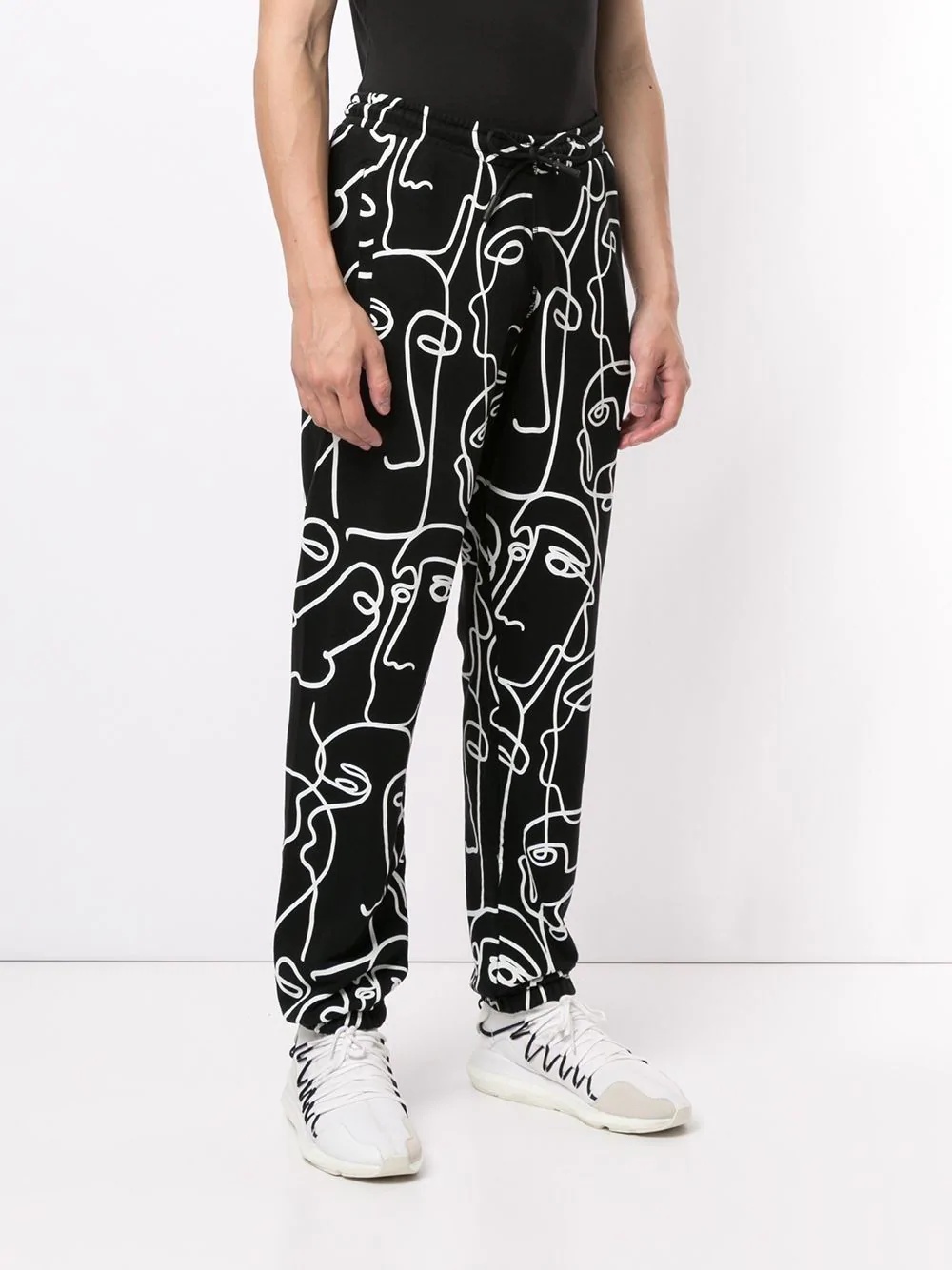 all-over Faces print track pants - 3