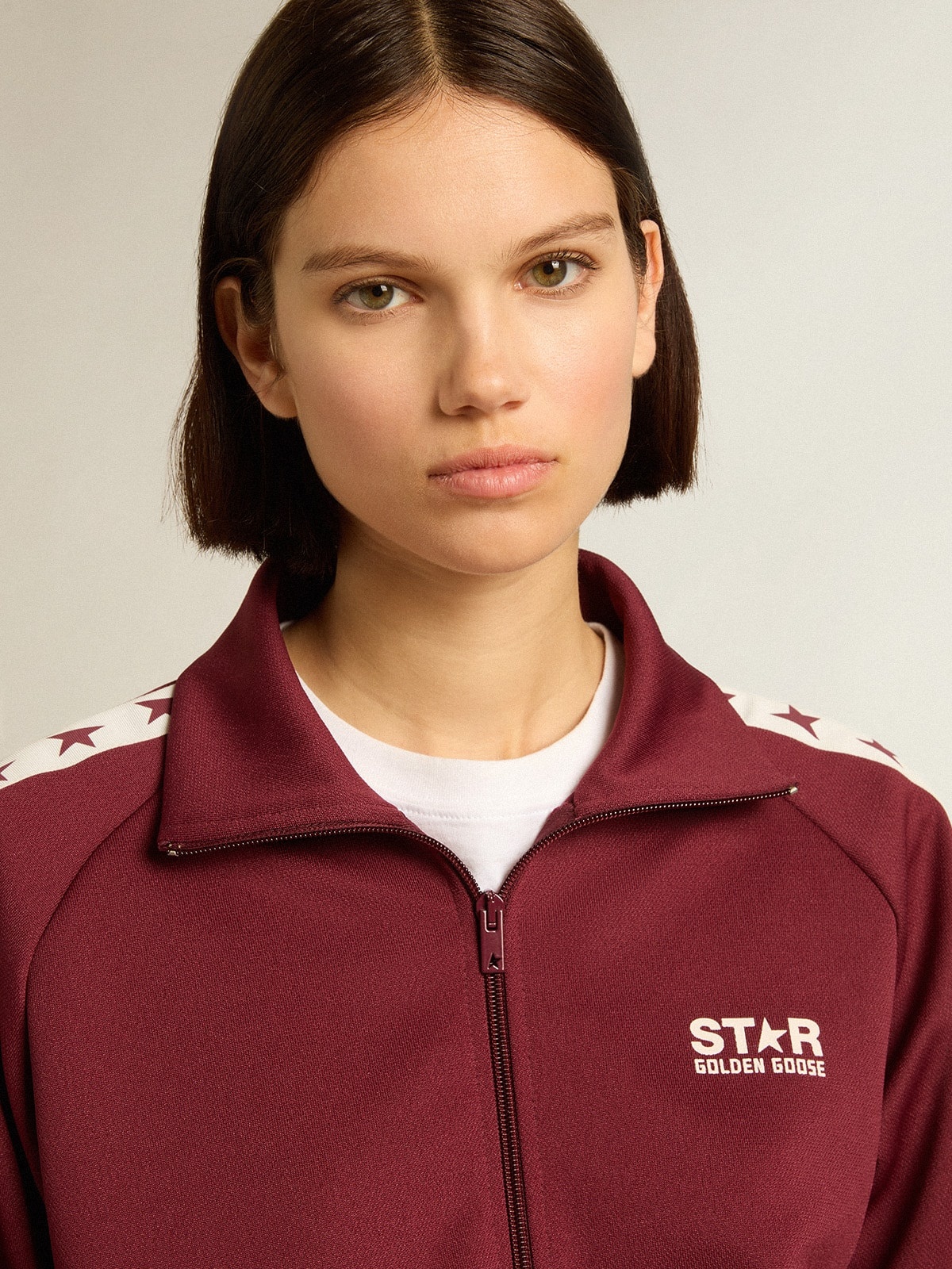 Women’s burgundy zipped sweatshirt with white strip and contrasting stars - 2