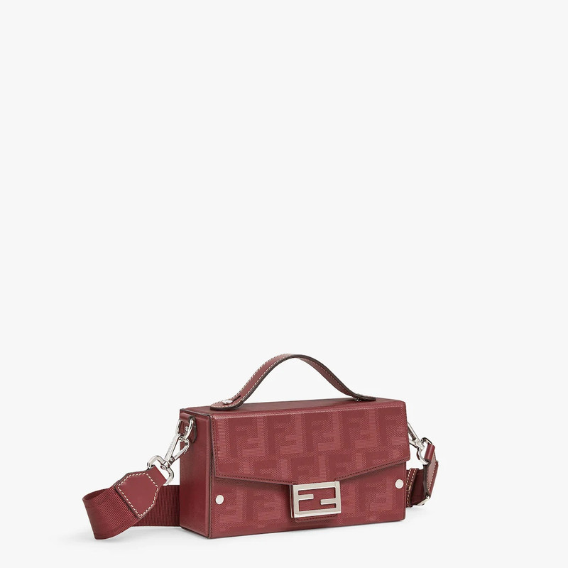Baguette Soft Trunk bag made of burgundy leather with a striped texture FF motif. Flap with magnetic 2