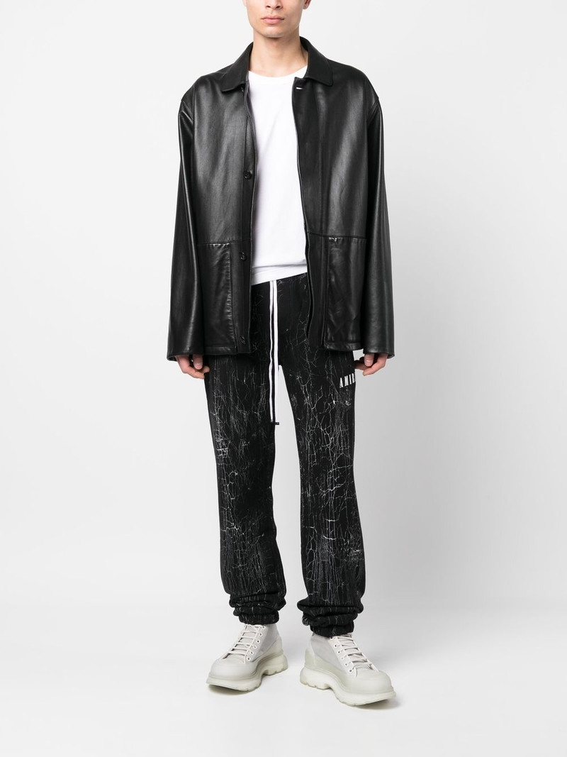 AMIRI cracked-dye logo track pants outlook