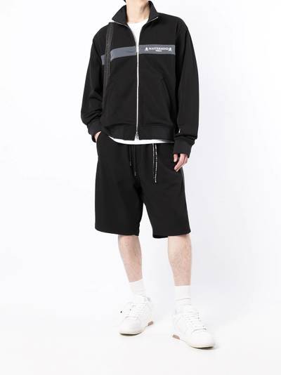 MASTERMIND WORLD skull-print side-stripe shorts outlook