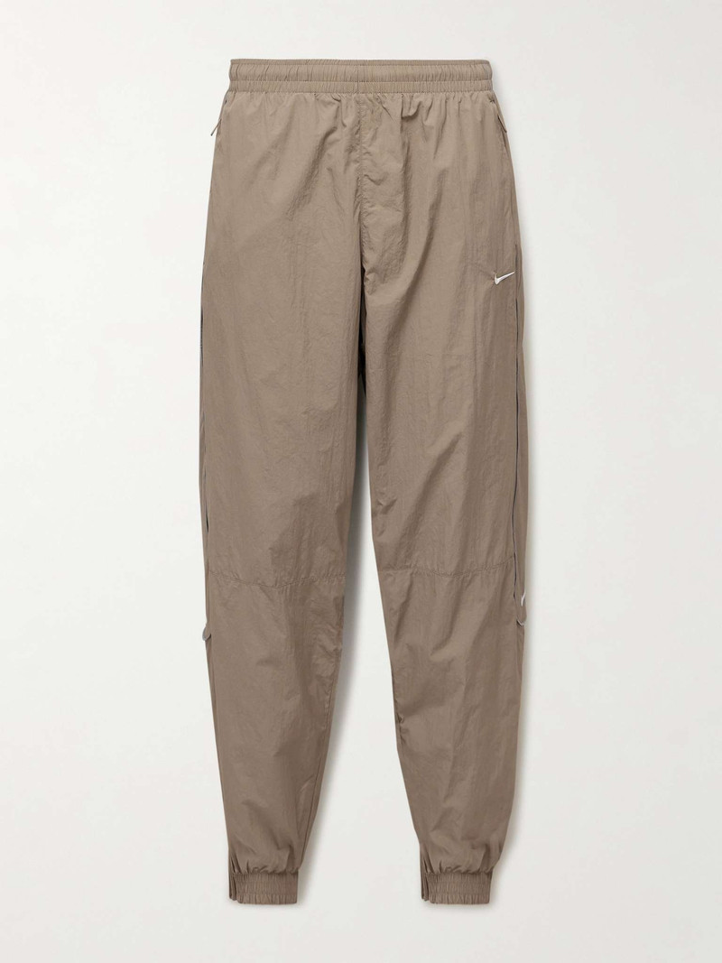 Solo Swoosh Tapered Logo-Embroidered Nylon Track Pants - 1