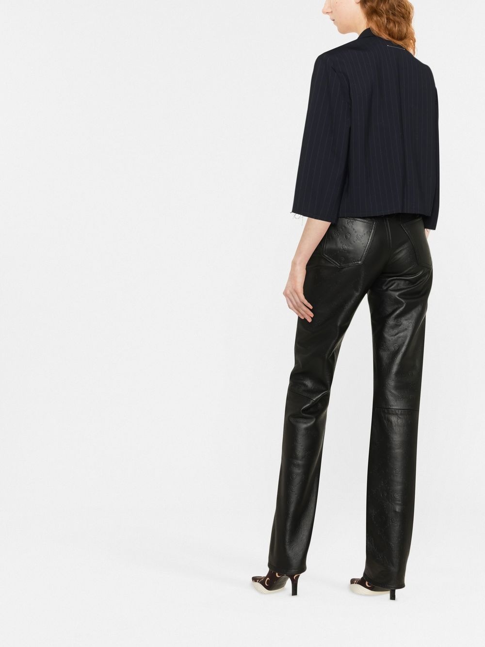 all-over embossed-logo leather trousers - 4