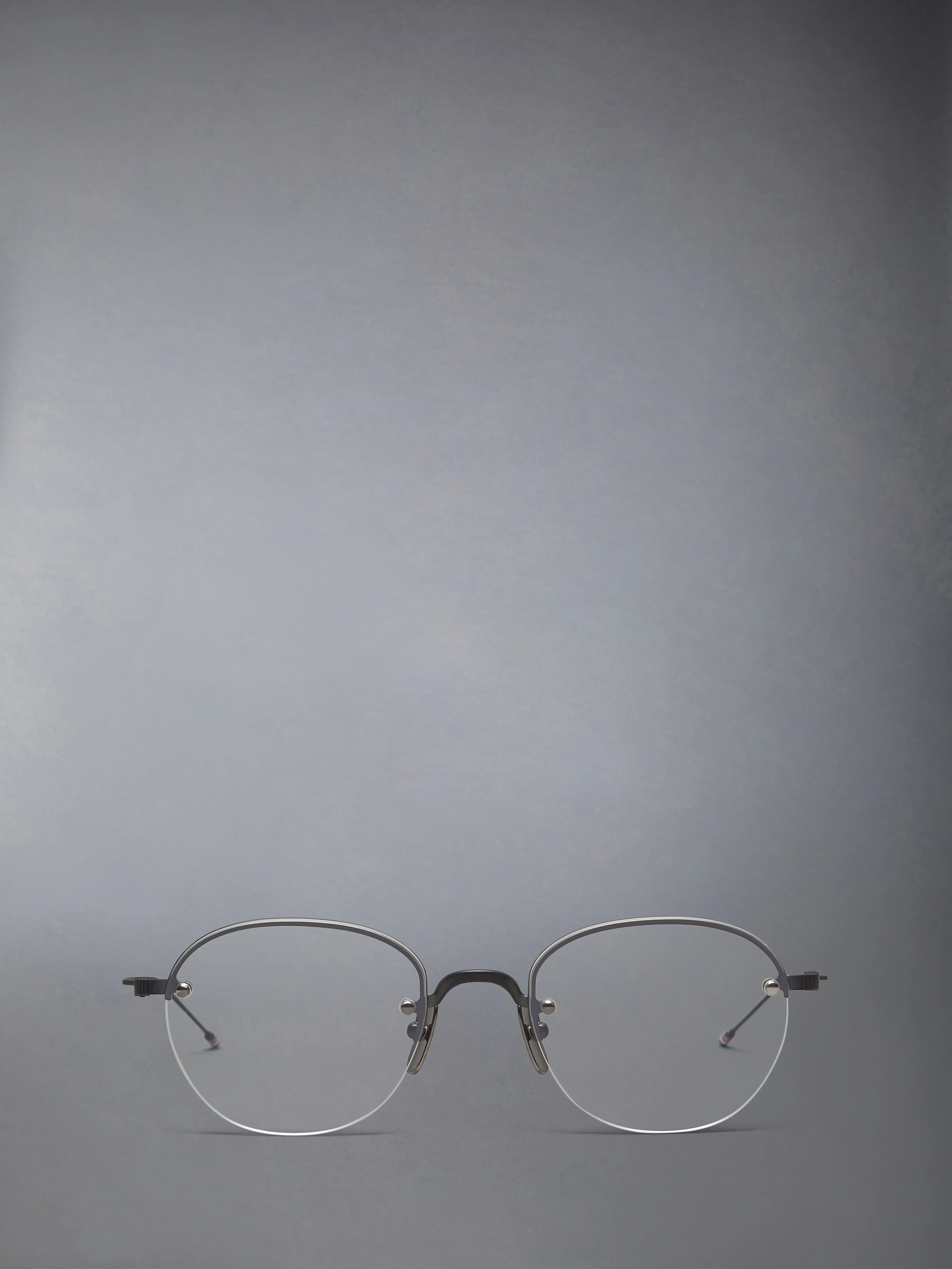 TITANIUM SEMI RIMLESS OVAL EYEGLASSES - 1
