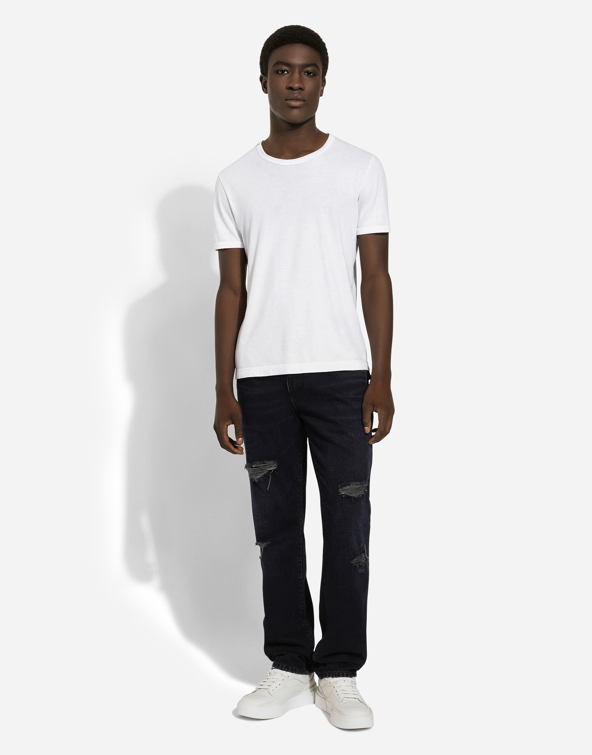 Blue denim jeans with abrasions and rips - 2