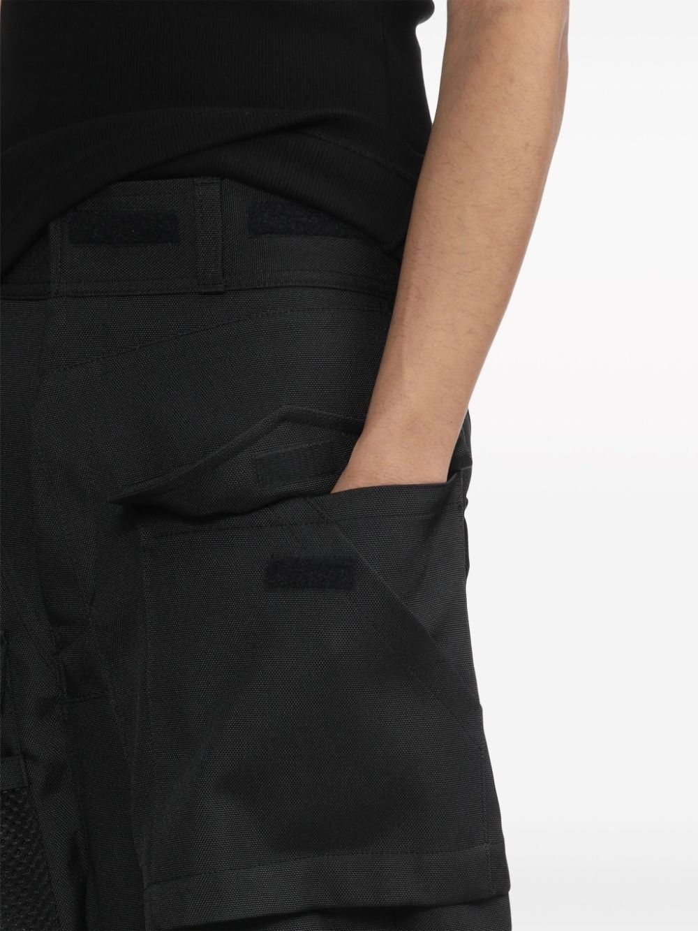 strap-detail asymmetric cargo trousers - 5