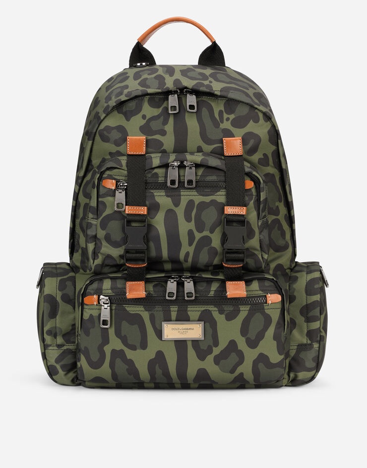 Nylon backpack with leopard print against a green background and branded plate - 1