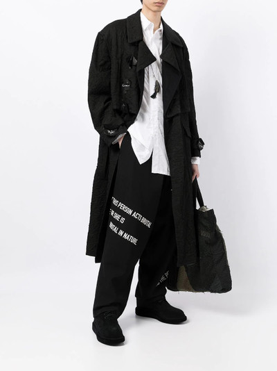 Yohji Yamamoto slogan-print straight-leg trousers outlook