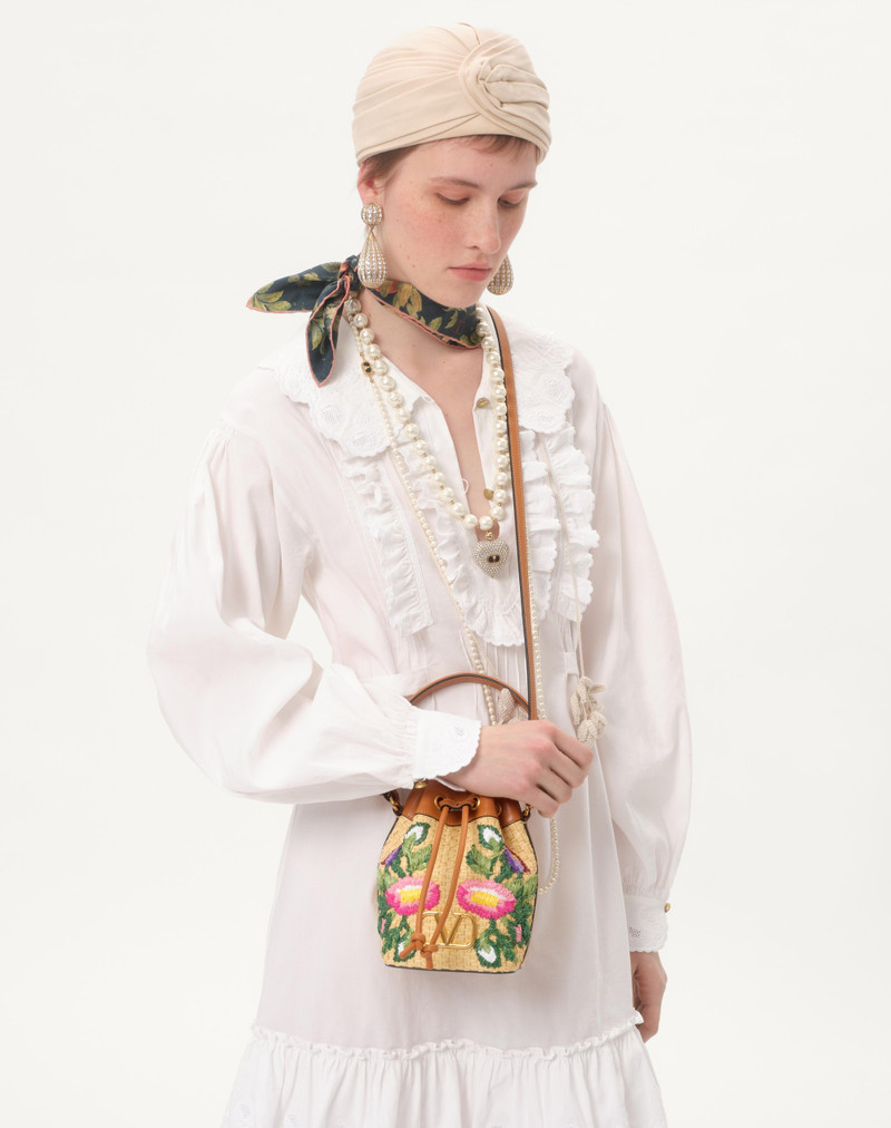 VLOGO SIGNATURE MINI BUCKET BAG IN RAFFIA WITH FLORAL EMBROIDERY 7