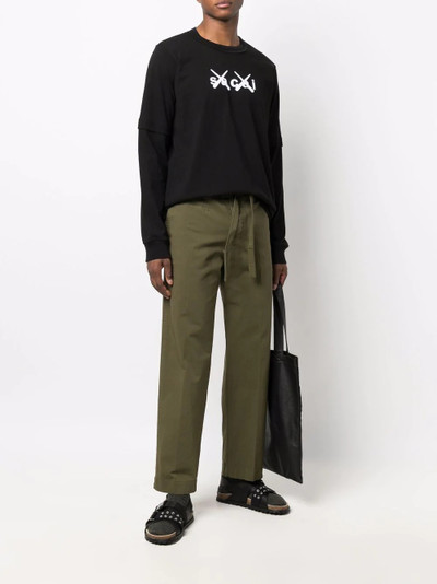 sacai x KAWS logo-print long-sleeve T-shirt outlook