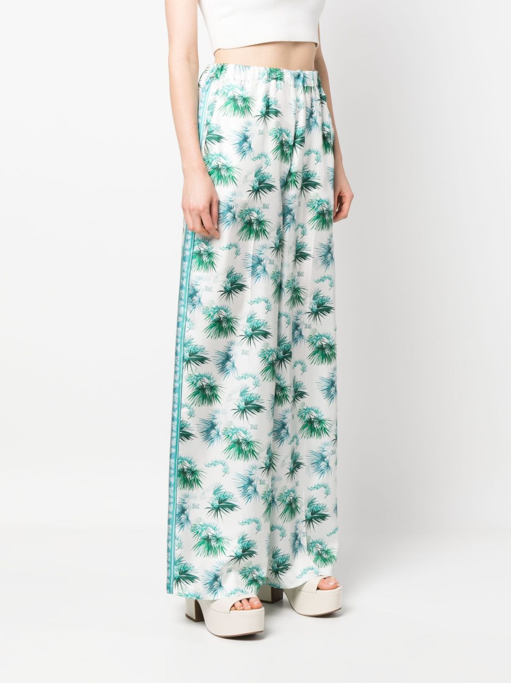 all-over graphic-print trousers - 3