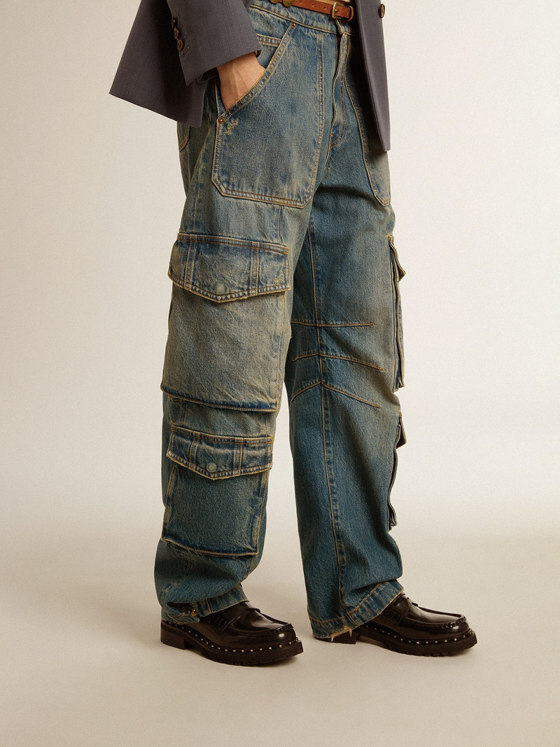 Blue jeans with a distressed finish 5