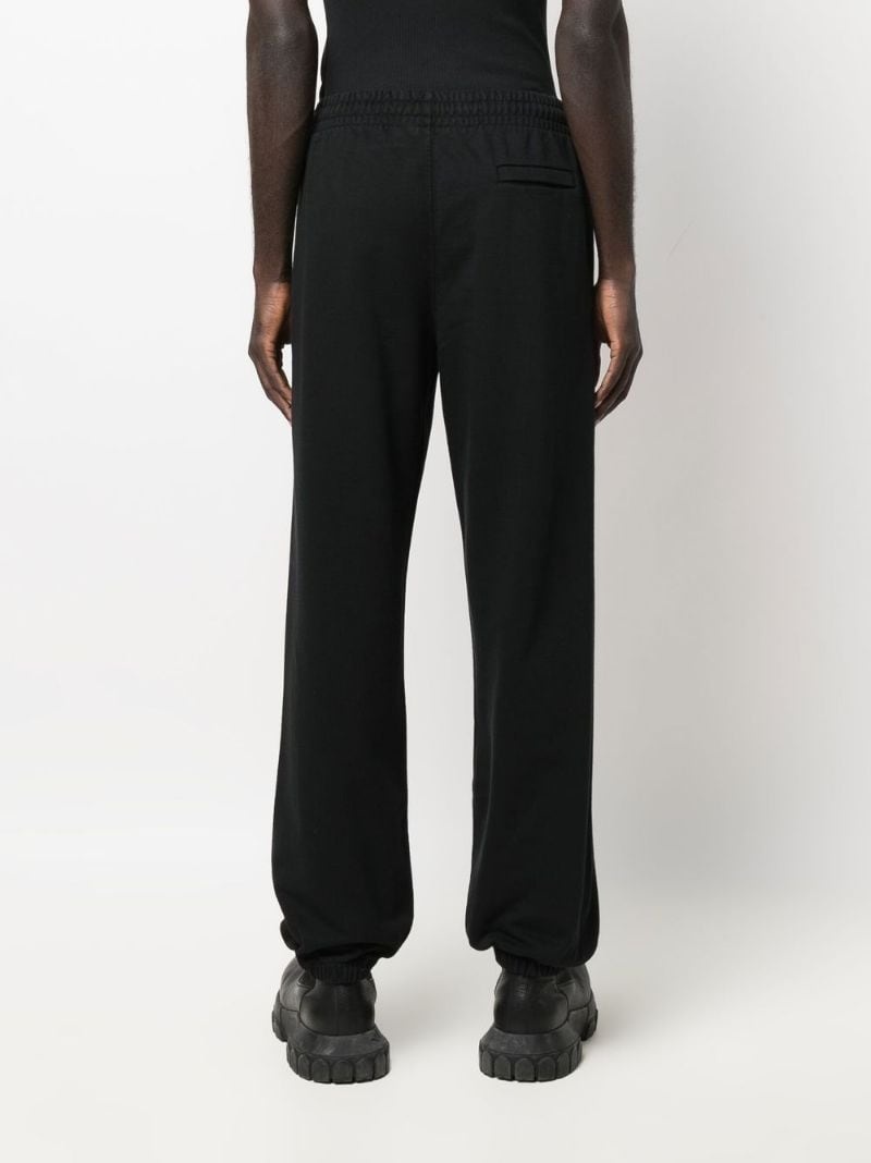 Helvetica-print track pants - 4