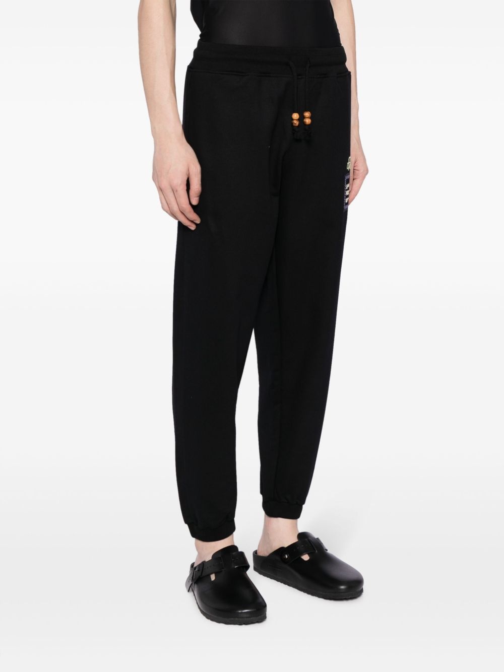 Alkhws logo-print cotton track pants - 3