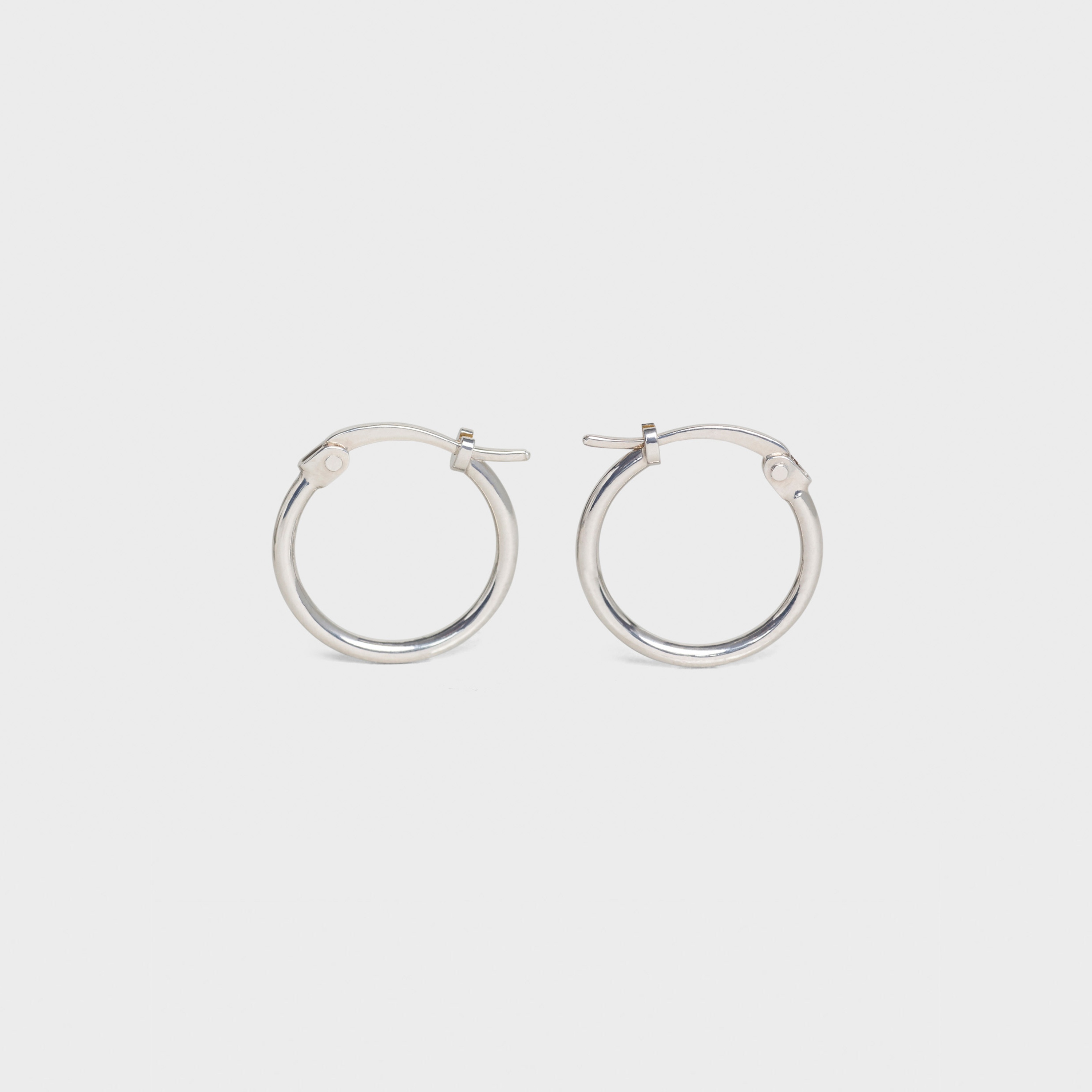 SIMPLE FORMS EXTRA SMALL HOOPS IN BRASS WITH RHODIUM FINISH - 1