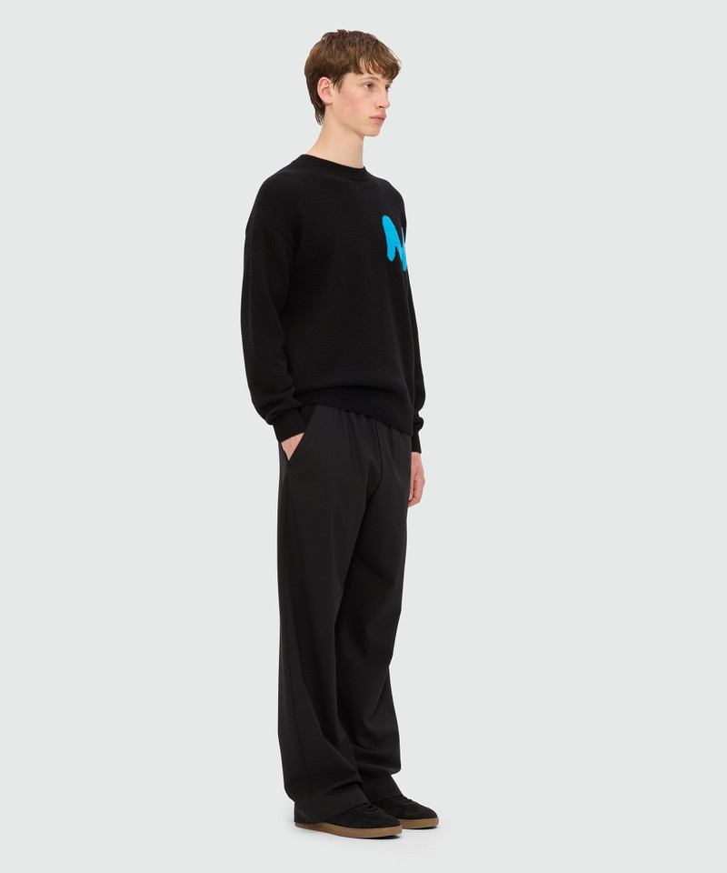 Black cashmere blend sweater with "TheMwave" patch 4