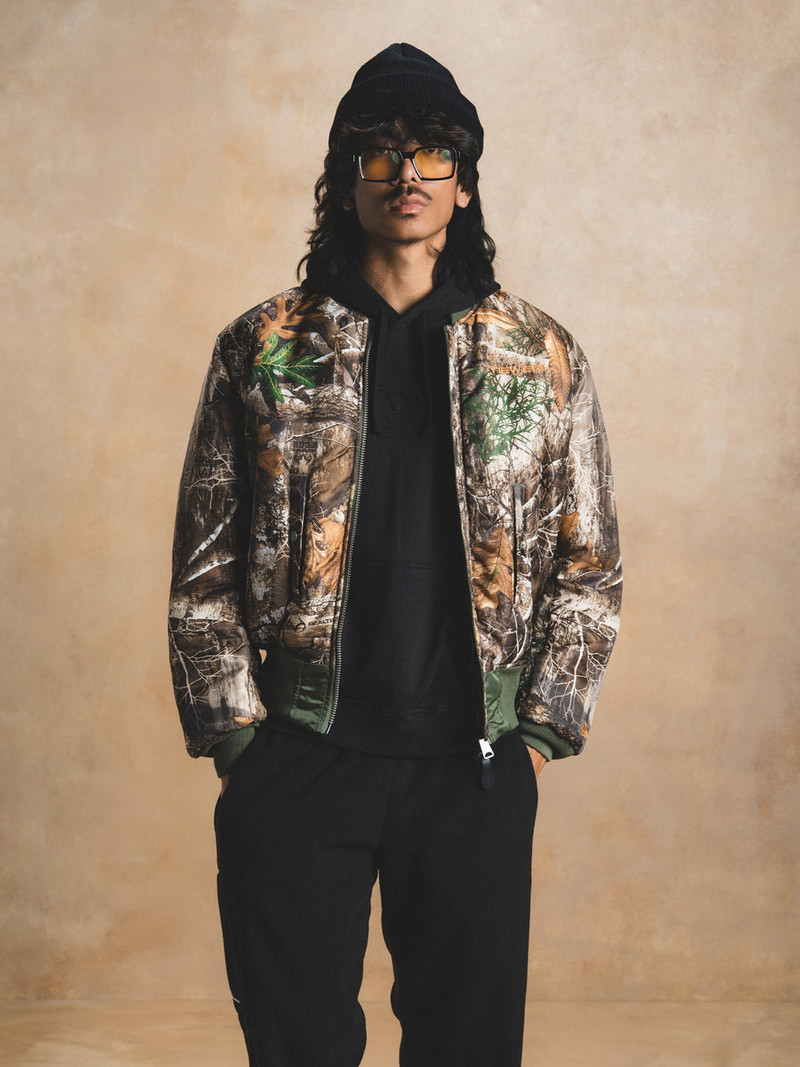 ALPHA INDUSTRIES ALPHA X NEW ERA X REALTREE CAMO MA-1 BOMBER JACKET outlook