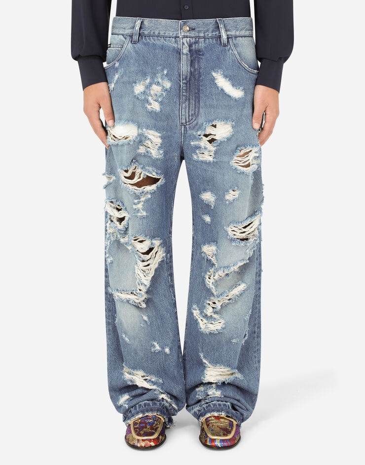 Oversize light blue wash jeans with rips - 1