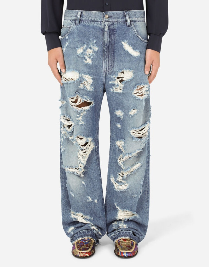 Oversize light blue wash jeans with rips 2
