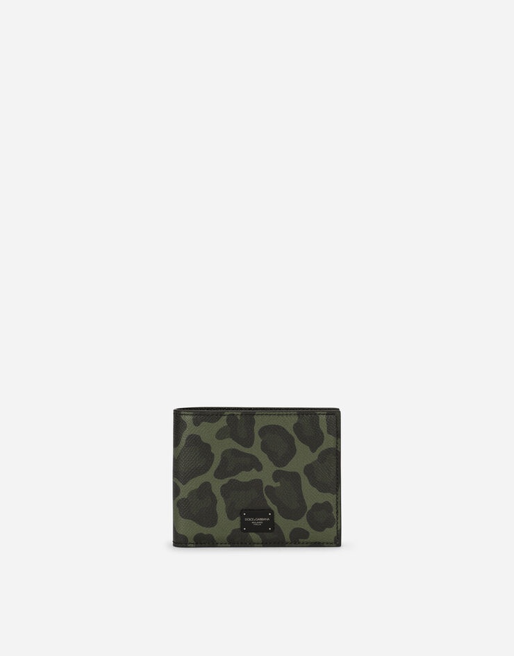 Dauphine calfskin bifold wallet with leopard print against a green background - 1