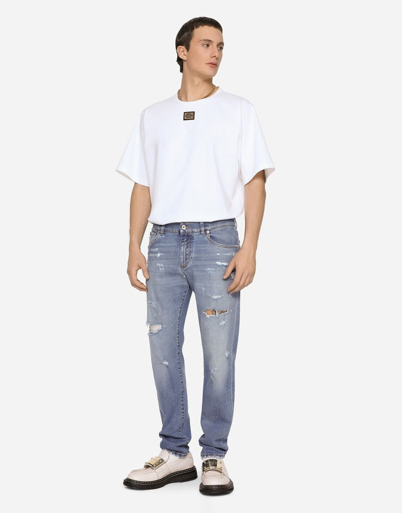 Light blue slim-fit stretch jeans with rips 1
