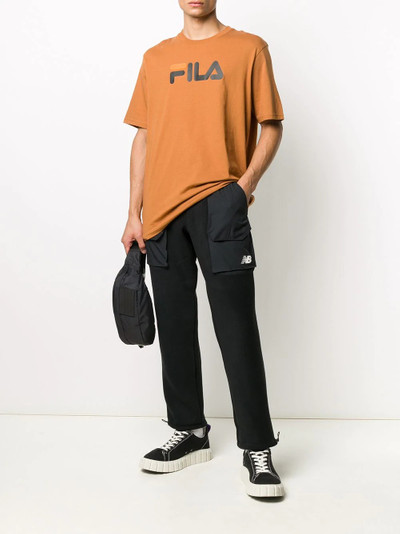 New Balance black utility trousers outlook