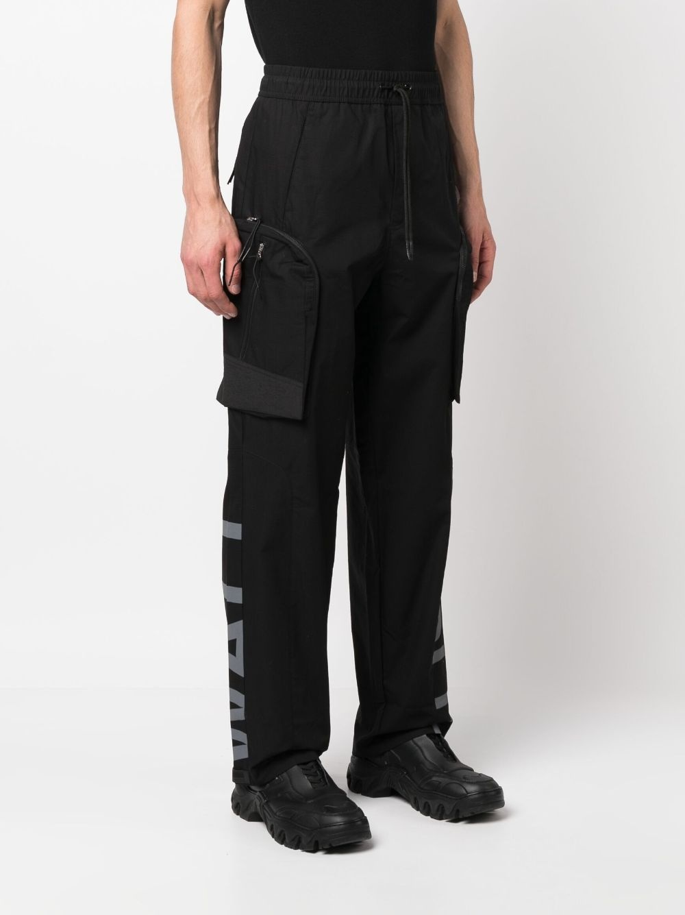 Overset Tech logo-print trousers - 3