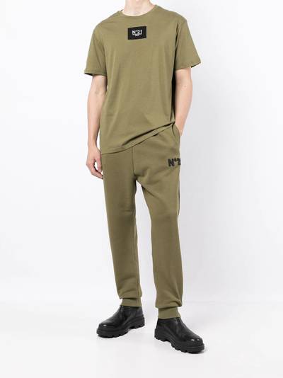 N°21 embossed logo tapered track trousers outlook