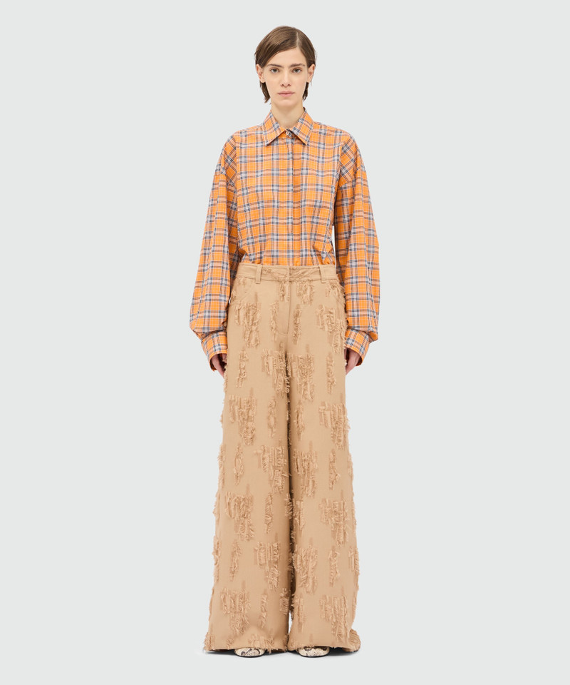 MSGM Beige wide-leg frayed fil coupe trousers. outlook