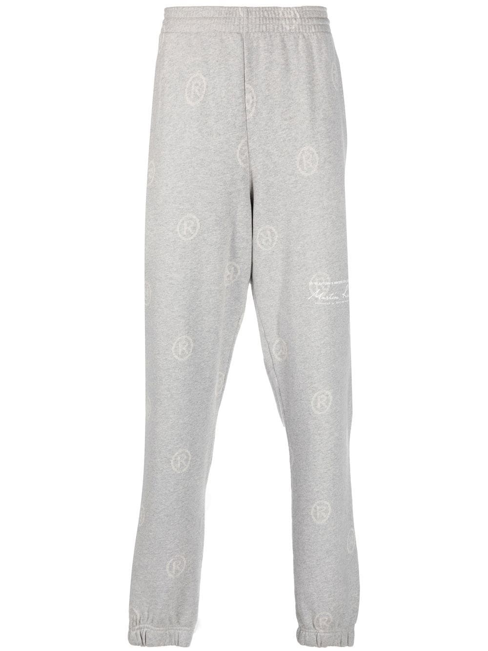all-over logo-print track pants - 1