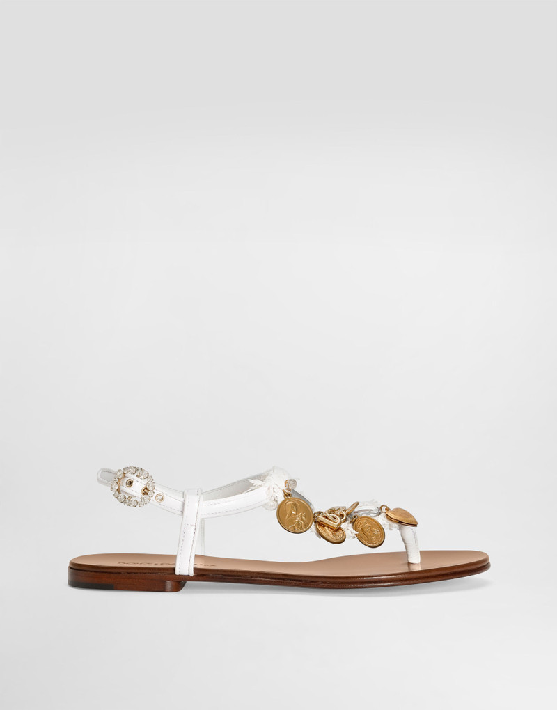 Raffia thong sandals with embroidered votive medallions 1