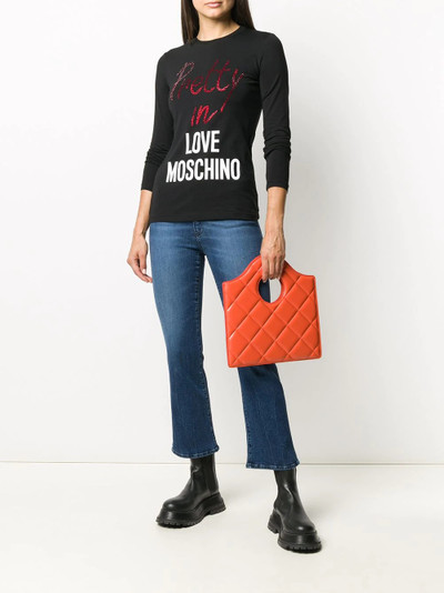 Moschino logo patch cropped jeans outlook