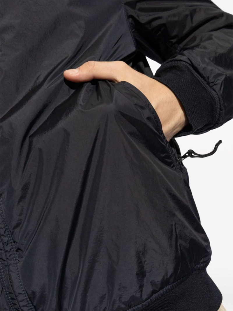 Compass-badge hooded windbreaker 5