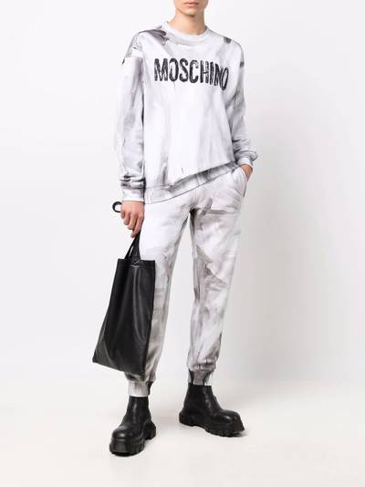 Moschino logo-print detail track pants outlook