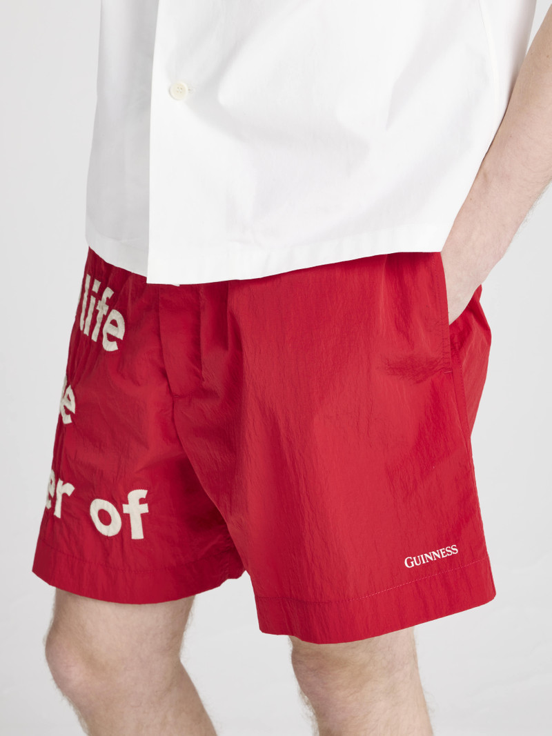 Unisex JW ANDERSON X GUINNESS SLOGAN TRACK SHORTS IN RED 10