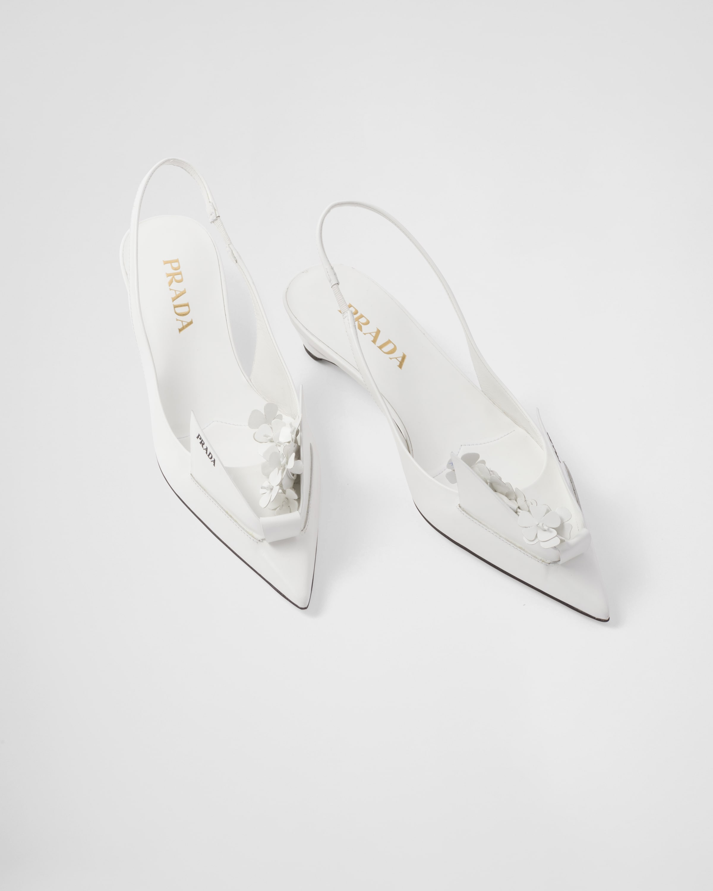 Prada Brushed leather slingback pumps with floral appliques