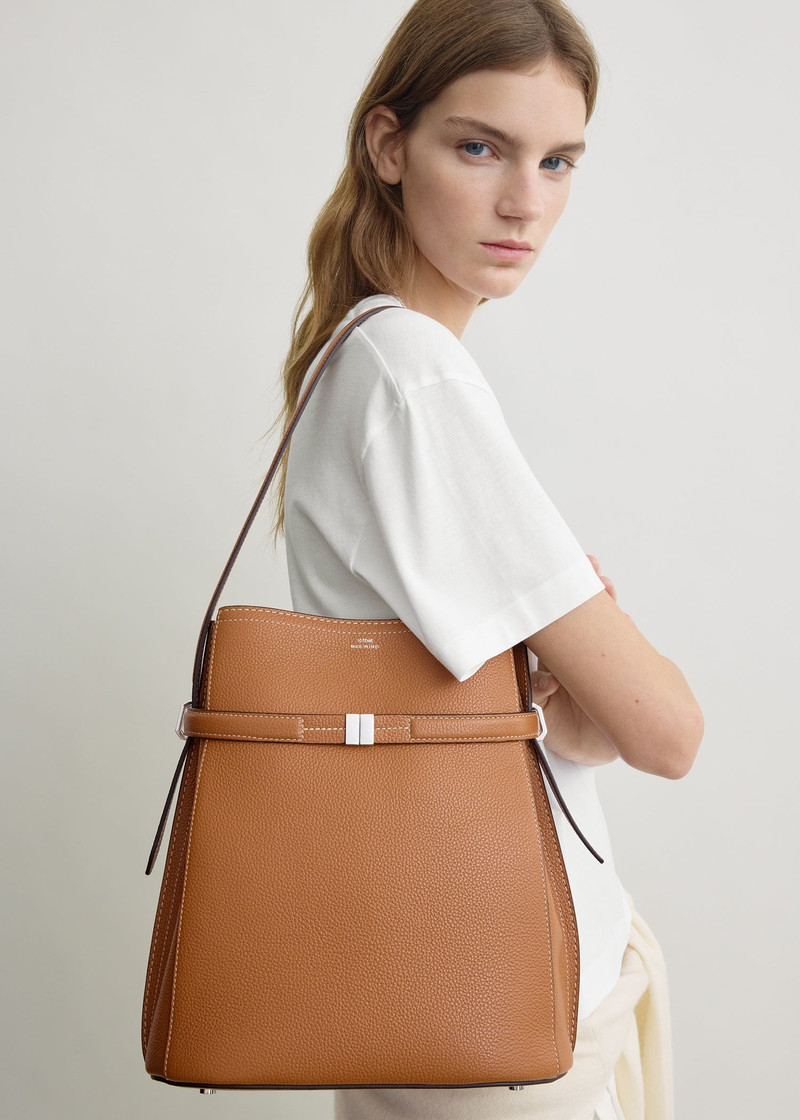 TOTEME Belted grained-leather bucket bag tan outlook