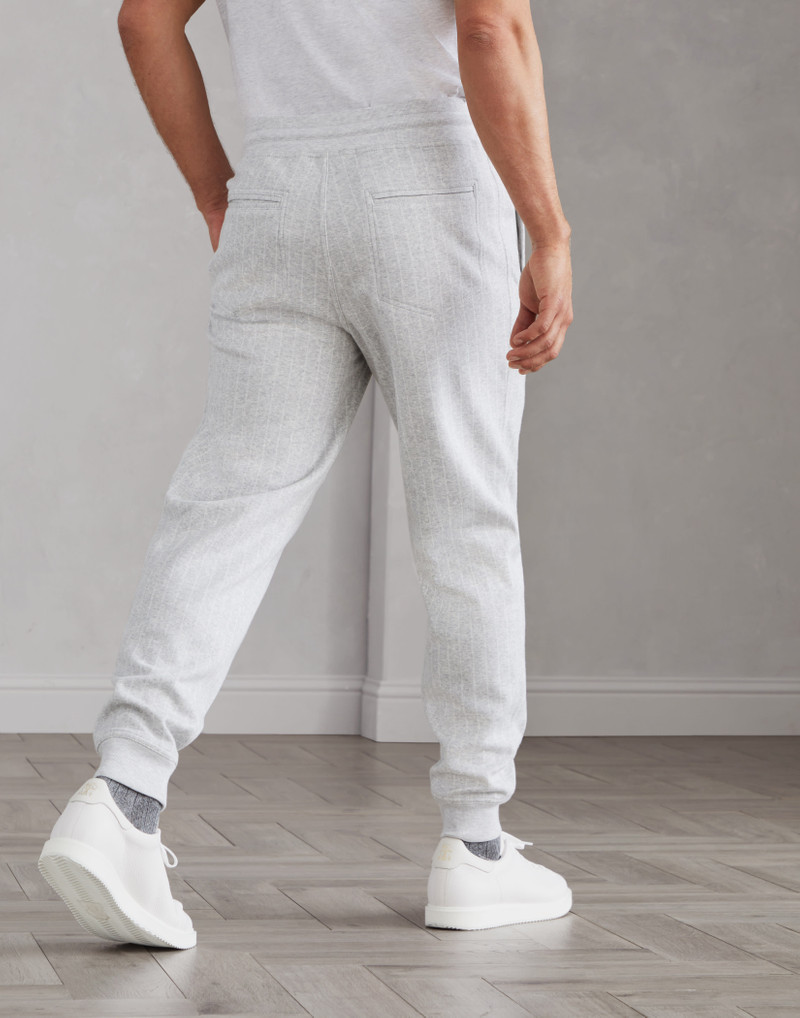 Brunello Cucinelli Cotton, cashmere and silk chalk stripe French terry double cloth trousers with elasticated cuffs outlook