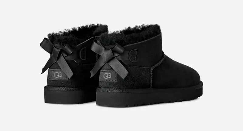 ® Women's Ultra Mini Bailey Bow Sheepskin Classic Boots in Black - 1