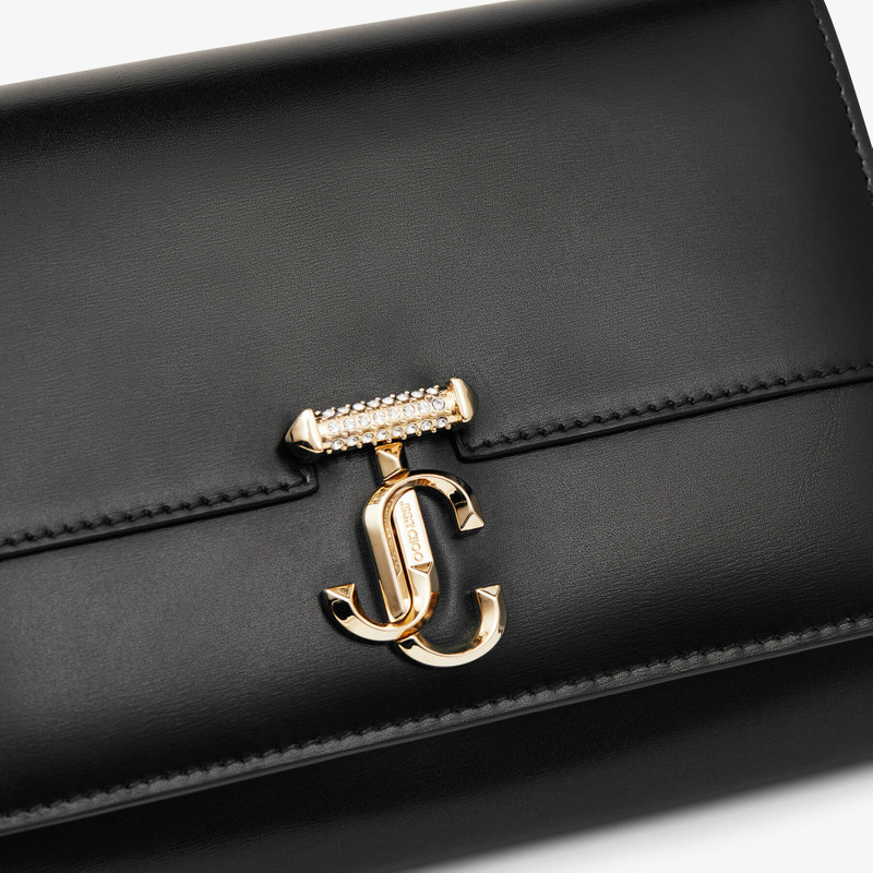 Varenne Clutch
Black Leather Clutch Bag with Crystal Bar and Gold JC Emblem 6