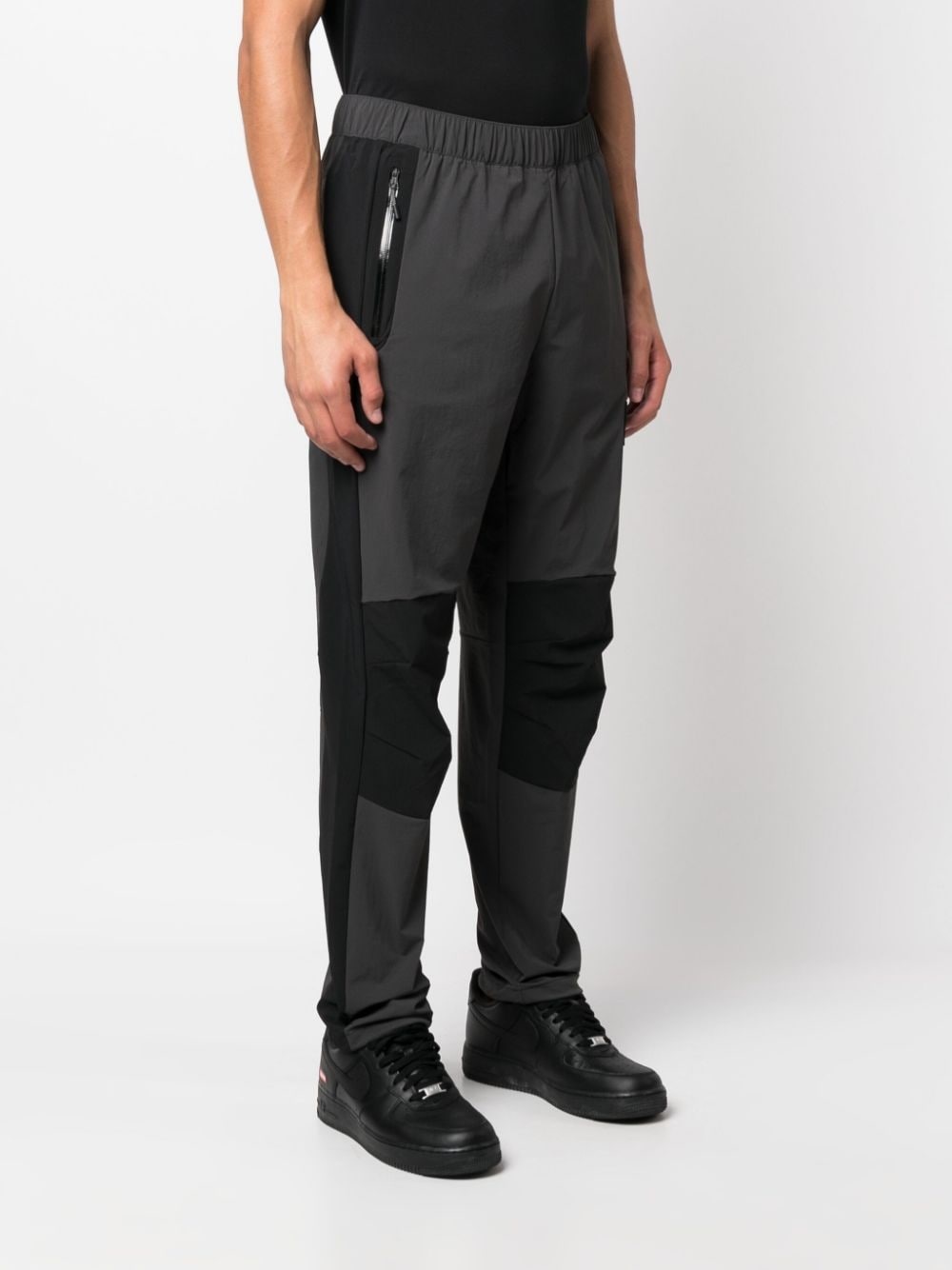 NSE Shell logo-print track pants - 3