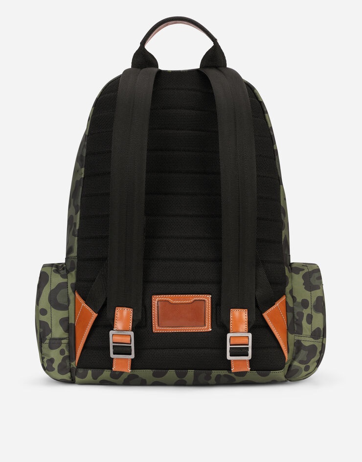 Nylon backpack with leopard print against a green background and branded plate - 4