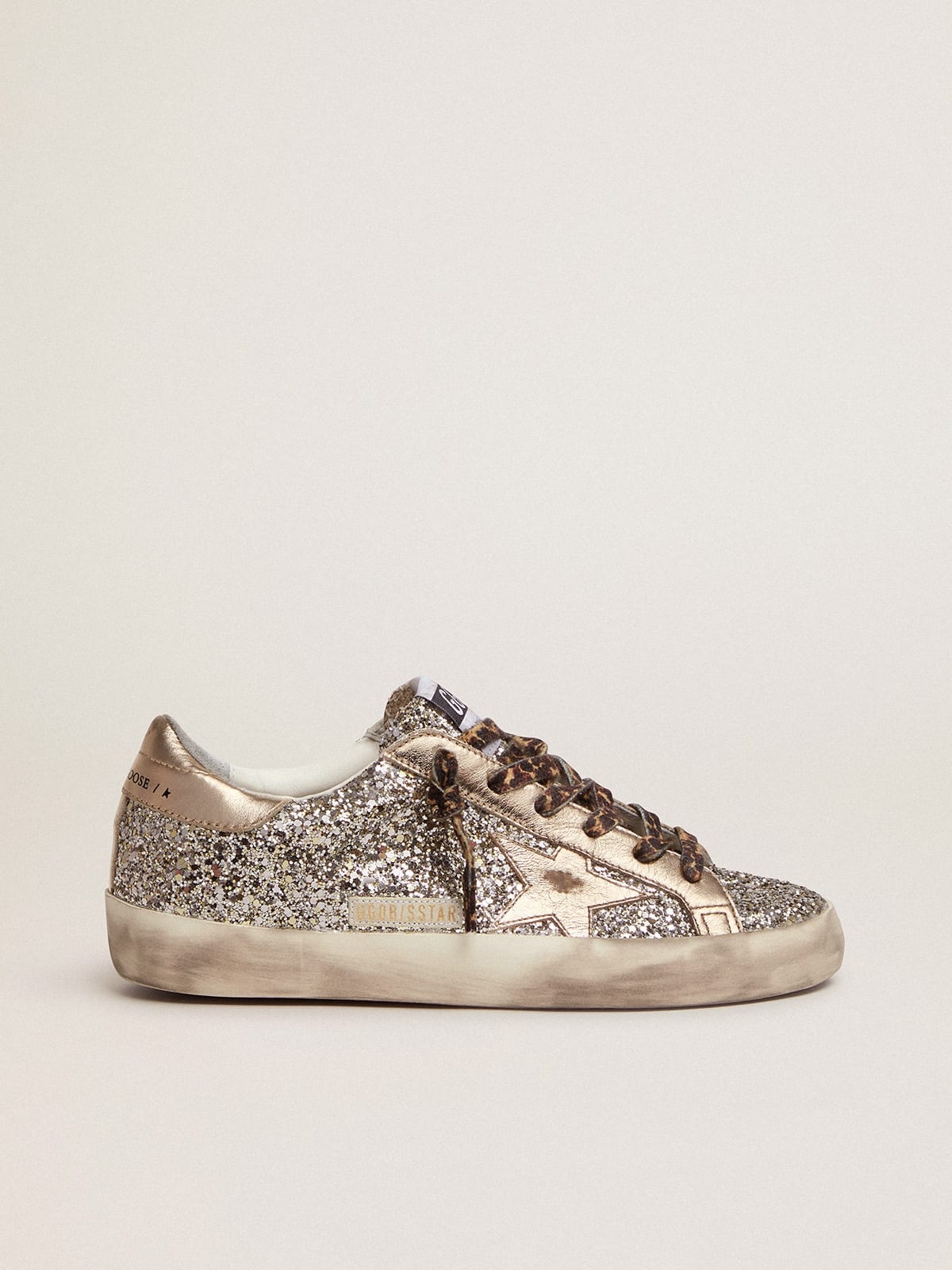 Golden Goose Super-Star sneakers in platinum-colored glitter with star and heel  tab in tone-on-tone laminated lea | REVERSIBLE