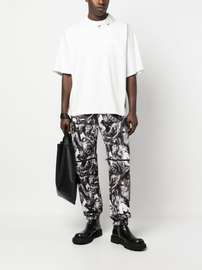 UNDERCOVER graphic-print track pants outlook