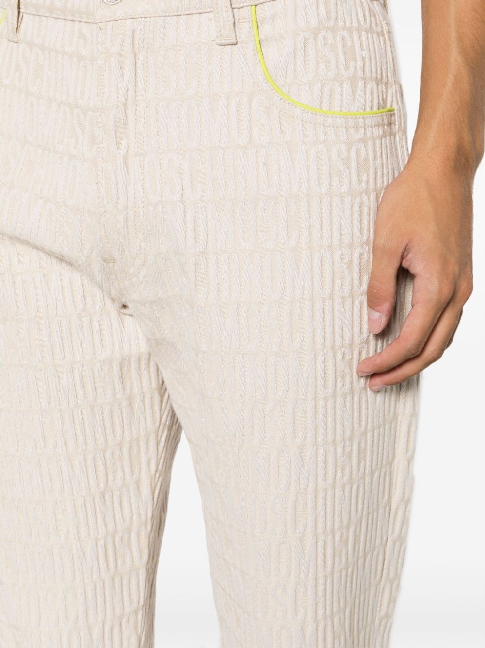 slim-cut logo-embossed jeans - 5